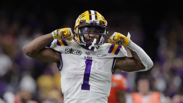 Jan 13, 2020; New Orleans, Louisiana, USA; LSU Tigers wide receiver Ja'Marr Chase (1) celebrates after making a 43 yard run against the Clemson Tigers in the third quarter in the College Football Playoff national championship game at Mercedes-Benz Superdome. Mandatory Credit: Derick E. Hingle-USA TODAY Sports