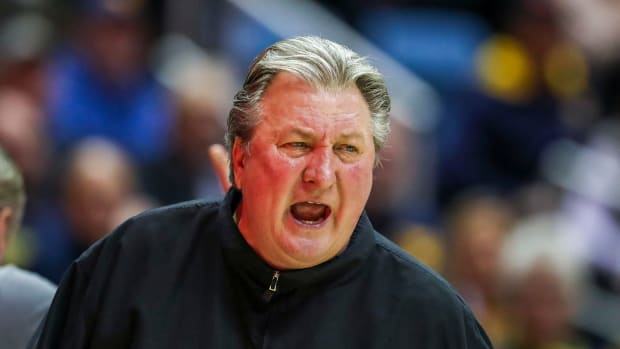 West Virginia Mountaineers head coach Bob Huggins yells from the bench during the second half against the TCU Horned Frogs at WVU Coliseum.