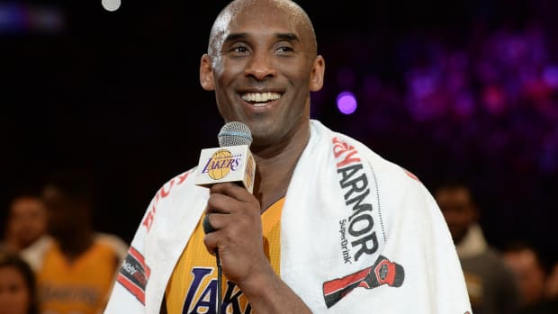 Apr 13, 2016; Los Angeles, CA, USA; Los Angeles Lakers forward Kobe Bryant (24) smiles as he addresses the crowd after the Lakers defeat of the Utah Jazz in the final game of his career at Staples Center. Mandatory Credit: Robert Hanashiro-USA TODAY Sports