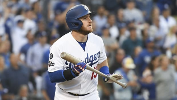 Oct 9, 2019; Los Angeles, CA, USA; Los Angeles Dodgers second baseman Max Muncy (13) looks up after hitting a two-run home run during the first inning in game five of the 2019 NLDS playoff baseball series against the Washington Nationals at Dodger Stadium.