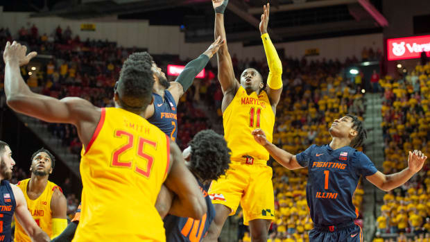 Maryland Terrapins guard Darryl Morsell (11) shoots as Illinois Fighting Illini forward Kipper Nichols (2) and guard Trent Frazier (1) defends during the second half at XFINITY Center.