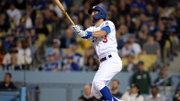 June 19, 2019; Los Angeles, CA, USA; Los Angeles Dodgers shortstop Chris Taylor (3) hits a solo home run against the San Francisco Giants during the fifth inning at Dodger Stadium.