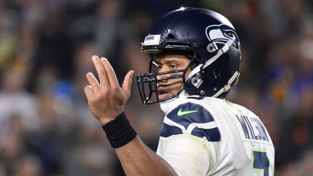 Seattle Seahawks quarterback Russell Wilson (3) signals to receives as he calls a play during the third quarter against the Los Angeles Rams at Los Angeles Memorial Coliseum.