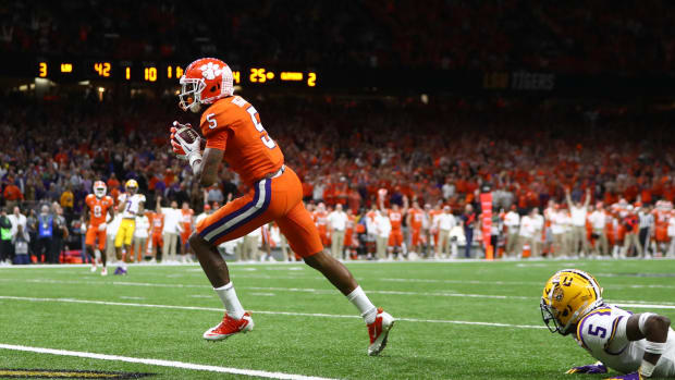 Jan 13, 2020; New Orleans, Louisiana, USA; Clemson Tigers wide receiver Tee Higgins (5) scores a touchdown in the College Football Playoff national championship game against the LSU Tigers at Mercedes-Benz Superdome.