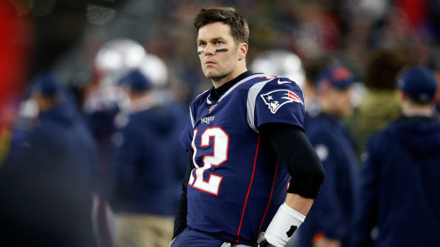 New England Patriots quarterback Tom Brady (12) watches an official review during the second quarter of a game against the Tennessee Titans at Gillette Stadium.