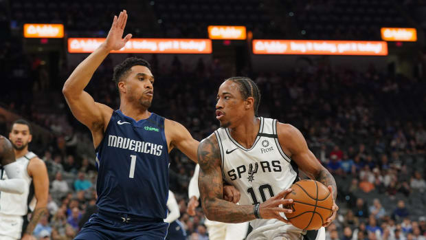 Spurs shooting guard DeMar DeRozan drives to the basket during a game against the Mavericks.