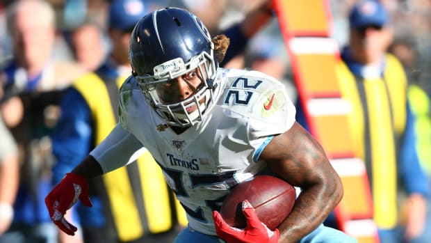 Tennessee Titans running back Derrick Henry (22) carries the ball during the fourth quarter against the Carolina Panthers at Bank of America Stadium.