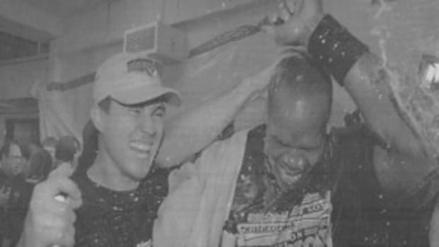 Magglio Ordoñez and Frank Thomas celebrate in the Metrodome after clinching the Central (Sun-Times clippings)