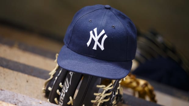 Yankees hat on glove