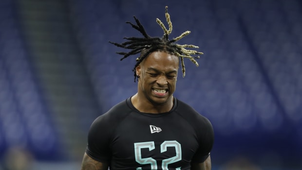 Mar 1, 2020; Indianapolis, Indiana, USA; Alabama Crimson Tide defensive back Xavier McKinney (DB52) grimaces in pain after hurting himself running the 40 yard dash during the 2020 NFL Combine at Lucas Oil Stadium.