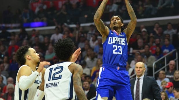 January 4, 2020; Los Angeles, California, USA; Los Angeles Clippers guard Lou Williams (23) shoots against Memphis Grizzlies guard Ja Morant (12) during the first half at Staples Center. Mandatory Credit: Gary A. Vasquez-USA TODAY Sports