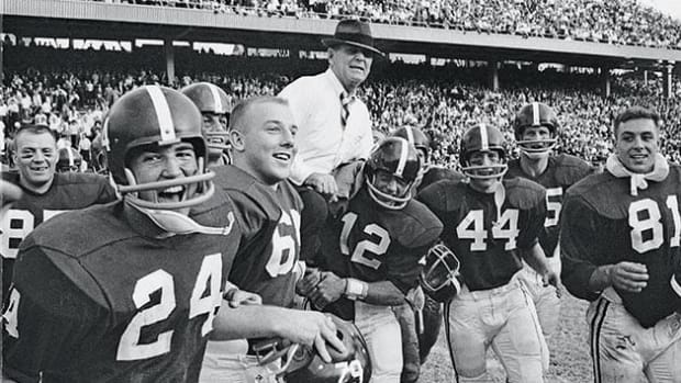 Paul W. "Bear" Bryant being carried off the field