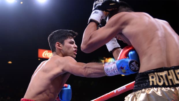 Ryan Garcia (blue trunks) and Romero Duno (black trunks) box during their WBC silver and NABO lightweight title bout at MGM Grand Garden Arena.