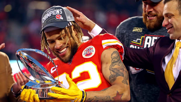 Jan 19, 2020; Kansas City, Missouri, USA; Kansas City Chiefs strong safety Tyrann Mathieu (32) celebrates with the Lamar Hunt Trophy after beating the Tennessee Titans in the AFC Championship Game at Arrowhead Stadium. Mandatory Credit: Mark J. Rebilas-USA TODAY Sports