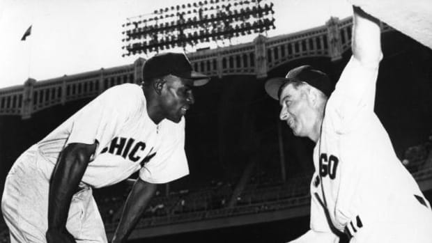 Minnie Minoso minnie-minoso-left-and-sam-mele-of-the-chicago-white-sox-have-a-talk-picture-id86373713