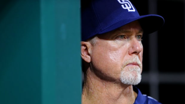 Aug 7, 2017; Cincinnati, OH, USA; San Diego Padres bench coach Mark McGwire (25) looks on from the dugout in the eighth inning at Great American Ball Park. Mandatory Credit: Aaron Doster-USA TODAY Sports