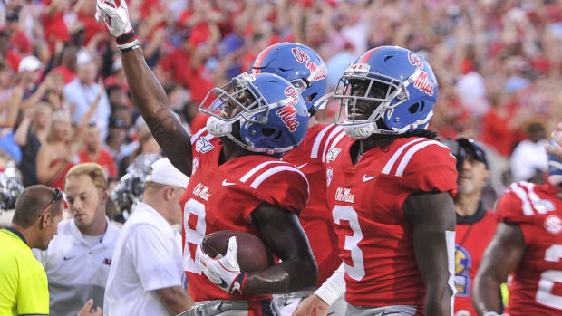 Mississippi Rebels wide receiver Elijah Moore (8) celebrates after scoring a touchdown during the first half against the Arkansas Razorbacks at Vaught-Hemingway Stadium. Mandatory Credit: Justin Ford-USA TODAY Sports