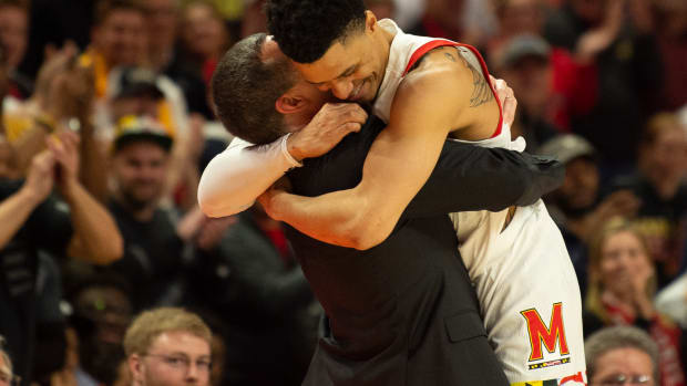 Mar 8, 2020; College Park, Maryland, USA; Maryland Terrapins head coach Mark Turgeon hugs guard Anthony Cowan Jr. (1) as time expires of the game Michigan Wolverines at XFINITY Center. Maryland won a share of the Big Ten regular season championship Mandatory Credit: Tommy Gilligan-USA TODAY Sports