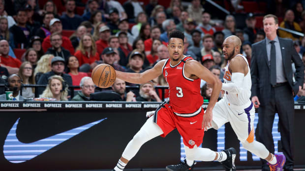 Mar 10, 2020; Portland, OR, USA; Portland Trail Blazers guard CJ McCollum (3) dribbles the ball up court in front of Phoenix Suns guard Jevon Carter (4) during the fourth quarter at the Moda Center. Mandatory Credit: Craig Mitchelldyer-USA TODAY Sports