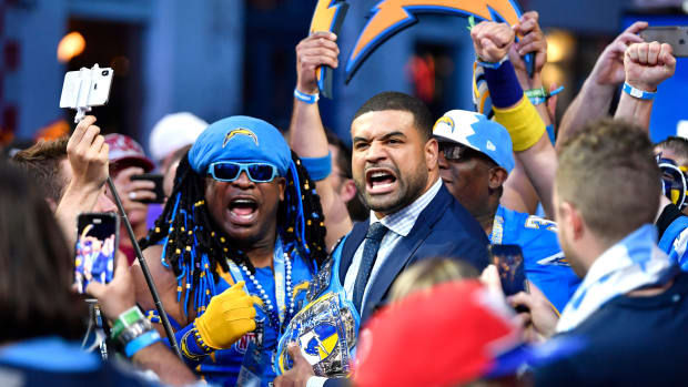 Former Charger Shawne Merriman mingles with Chargers fan after making the second-round pick during the second day of the NFL Draft Friday, April 26, 2019, in Nashville, Tenn. Gw53693