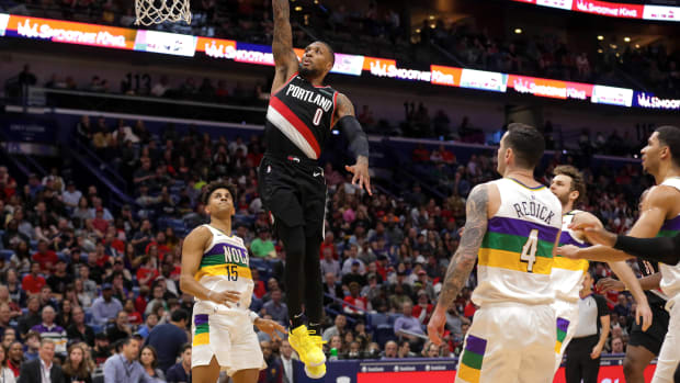 Feb 11, 2020; New Orleans, Louisiana, USA; Portland Trail Blazers guard Damian Lillard (0) dunks against the New Orleans Pelicans during the second half at the Smoothie King Center. Mandatory Credit: Derick E. Hingle-USA TODAY Sports