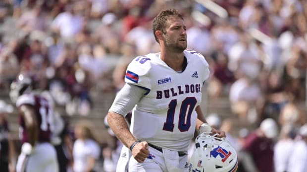 Sep 4, 2021; Starkville, Mississippi, USA; Louisiana Tech Bulldogs quarterback Austin Kendall (10) leaves the field for a down after losing his helmet during a play against the Mississippi State Bulldogs during the first quarter at Davis Wade Stadium at Scott Field. Mandatory Credit: Matt Bush-USA TODAY Sports