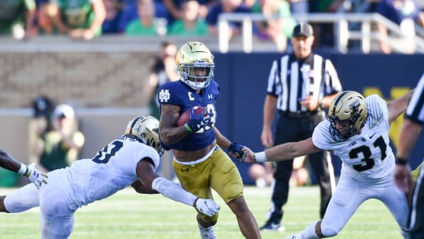 Sep 18, 2021; South Bend, Indiana, USA; Notre Dame Fighting Irish running back Kyren Williams (23) runs the ball on a punt return in the fourth quarter against the Purdue Boilermakers at Notre Dame Stadium. Mandatory Credit: Matt Cashore-USA TODAY Sports