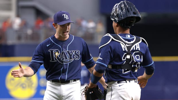Sep 22, 2021; St. Petersburg, Florida, USA; Tampa Bay Rays relief pitcher David Robertson (30) and Tampa Bay Rays catcher Francisco Mejia (28) celebrate as they beat the Toronto Blue Jays to clinch a playoff spot at Tropicana Field.