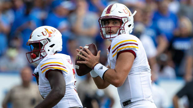 Rhett Rodriguez about to throw a pass.