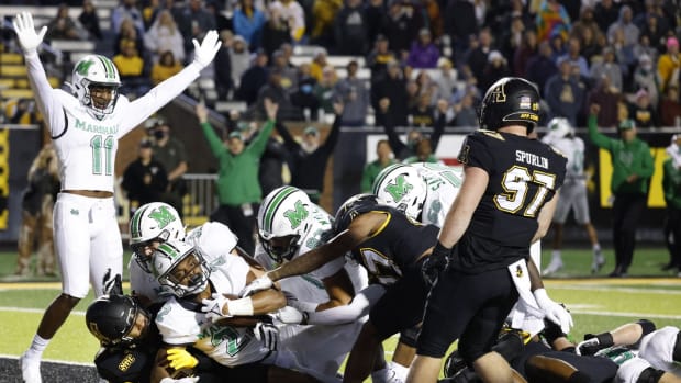 Sep 23, 2021; Boone, North Carolina, USA; Marshall Thundering Herd running back Rasheen Ali (22) dives into the endzone for the score as tight end Xavier Gaines (11) celebrates during the second half against the Appalachian State Mountaineers at Kidd Brewer Stadium. Mandatory Credit: Reinhold Matay-USA TODAY Sports