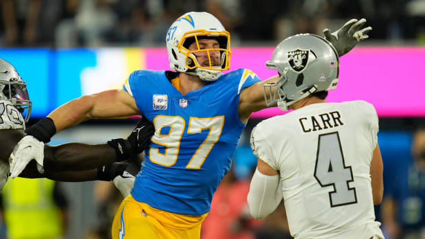 Chargers defensive end Joey Bosa attempts to sack Raiders quarterback Derek Carr