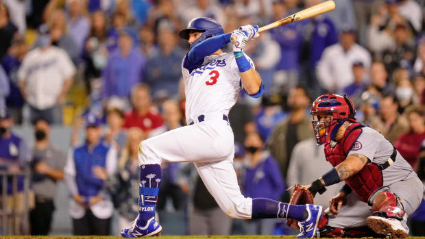 Oct 6, 2021; Los Angeles, California, USA; Los Angeles Dodgers left fielder Chris Taylor (3) hits a walk-off two run home run against the St. Louis Cardinals during the ninth inning at Dodger Stadium. The Los Angeles Dodgers won 3-1.