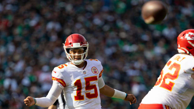 Oct 3, 2021; Philadelphia, Pennsylvania, USA; Kansas City Chiefs quarterback Patrick Mahomes (15) throws for a touchdown against the Philadelphia Eagles during the fourth quarter at Lincoln Financial Field. Mandatory Credit: Bill Streicher-USA TODAY Sports