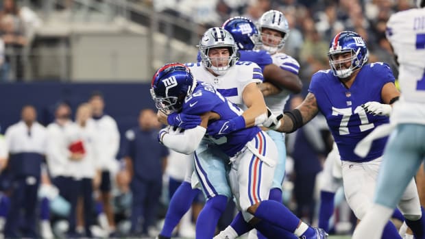 Saquon Barkley is tackled against Dallas.