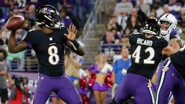 Lamar Jackson sets to throw for Ravens against the Colts.
