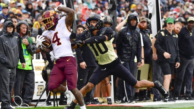 Oct 2, 2021; West Lafayette, Indiana, USA; Minnesota Golden Gophers running back Mar'Keise Irving (4) is pushed out of bounds by Purdue Boilermakers safety Cam Allen (10) during the second quarter at Ross-Ade Stadium. Mandatory Credit: Marc Lebryk-USA TODAY Sports