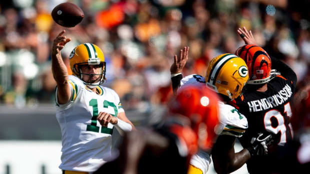 Green Bay Packers quarterback Aaron Rodgers (12) throws a pass as Cincinnati Bengals defensive end Trey Hendrickson (91) attempts to deflect it in the second half of the NFL football game on Sunday, Oct. 10, 2021, at Paul Brown Stadium in Cincinnati. Green Bay Packers defeated Cincinnati Bengals 25-22 in overtime.

Green Bay Packers At Cincinnati Bengals 59