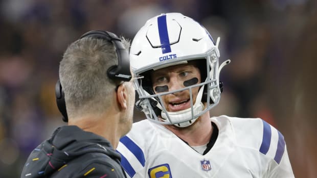 Oct 11, 2021; Baltimore, Maryland, USA; Indianapolis Colts quarterback Carson Wentz (2) talks with Indianapolis Colts head coach Frank Reich (L) during a timeout against the Baltimore Ravens in the final seconds of the fourth quarter at M&amp;T Bank Stadium. Mandatory Credit: Geoff Burke-USA TODAY Sports
