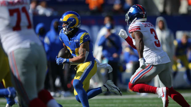Oct 17, 2021; East Rutherford, New Jersey, USA; Los Angeles Rams free safety Taylor Rapp (24) runs back an interception against the New York Giants during the second quarter at MetLife Stadium.