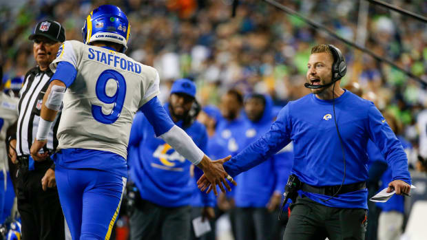 Oct 7, 2021; Seattle, Washington, USA; Los Angeles Rams head coach Sean McVay (right) celebrates with quarterback Matthew Stafford (9) following a touchdown against the Seattle Seahawks during the fourth quarter at Lumen Field.