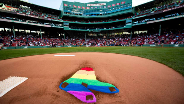 BOSTON, MA - JUNE 11: The Boston Red Sox rainbow logo is displayed in the dirt on the pitcher's mound in recognition of Pride night before a game against the Texas Rangers on June 11, 2019 at Fenway Park in Boston, Massachusetts. (Photo by Billie Weiss/Boston Red Sox/Getty Images)