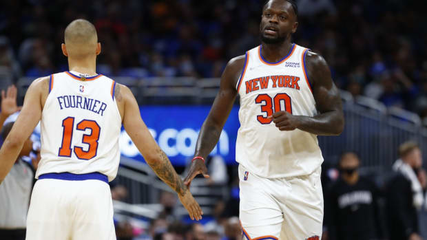 Oct 22, 2021; Orlando, Florida, USA; New York Knicks forward Julius Randle (30) is congratulated by New York Knicks guard Evan Fournier (13) during the second half at Amway Center. Mandatory Credit: Kim Klement-USA TODAY Sports