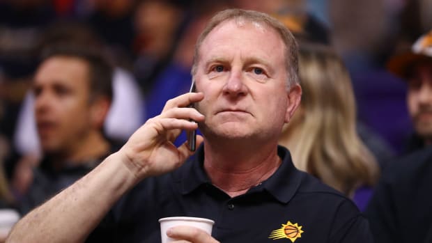 Jan 10, 2020; Phoenix, Arizona, USA; Phoenix Suns owner Robert Sarver talks on a cell phone against the Orlando Magic at Talking Stick Resort Arena.
