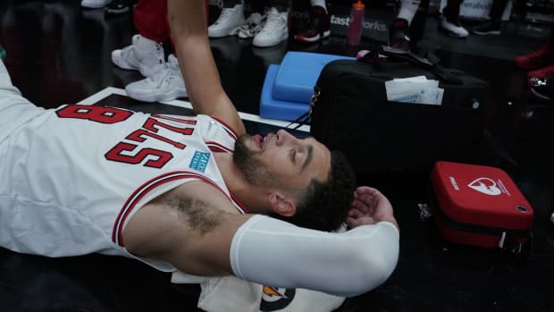Oct 23, 2021; Chicago, Illinois, USA; Chicago Bulls guard Zach LaVine (8) lies down after bing taken out of the game in the during the second half at United Center. Mandatory Credit: David Banks-USA TODAY Sports