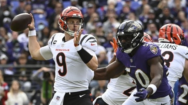 Oct 24, 2021; Baltimore, Maryland, USA; Cincinnati Bengals quarterback Joe Burrow (9) looks to throw as Baltimore Ravens outside linebacker Justin Houston (50) rushes during the first quarter at M&T Bank Stadium. Mandatory Credit: Tommy Gilligan-USA TODAY Sports