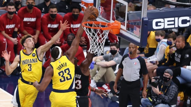 Oct 23, 2021; Indianapolis, Indiana, USA; Indiana Pacers center Myles Turner (33) blocks a shot by Miami Heat center Bam Adebayo (13) during the first half at Gainbridge Fieldhouse. Mandatory Credit: Robert Meyer-USA TODAY Sports