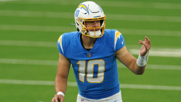 Dec 27, 2020; Inglewood, California, USA; Los Angeles Chargers quarterback Justin Herbert (10) gestures at the line against the Denver Broncos in the third quarter at SoFi Stadium. Mandatory Credit: Kirby Lee-USA TODAY Sports