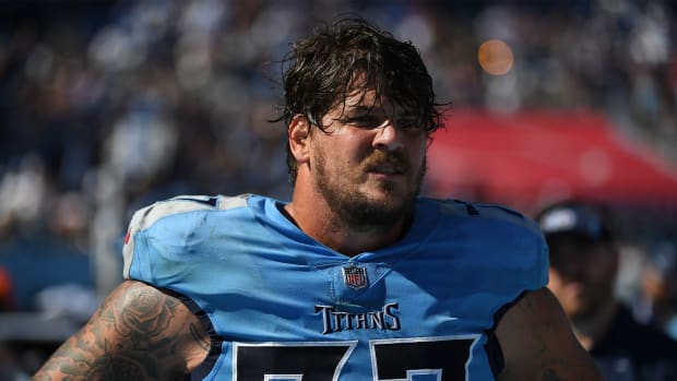Sep 26, 2021; Nashville, Tennessee, USA; Tennessee Titans offensive tackle Taylor Lewan (77) on the sideline during the second half against the Indianapolis Colts at Nissan Stadium.