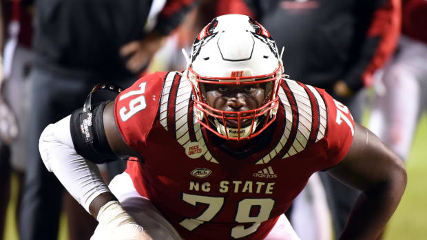 North Carolina State Wolfpack tackle Ikem Ekwonu (79) warms up prior to a game against the Louisville Cardinals at Carter-Finley Stadium.