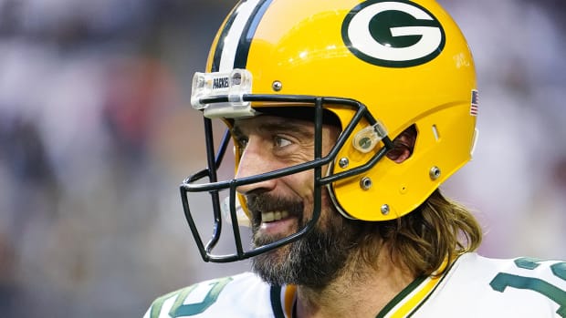 Aaron Rodgers smiling while playing the Cardinals.
